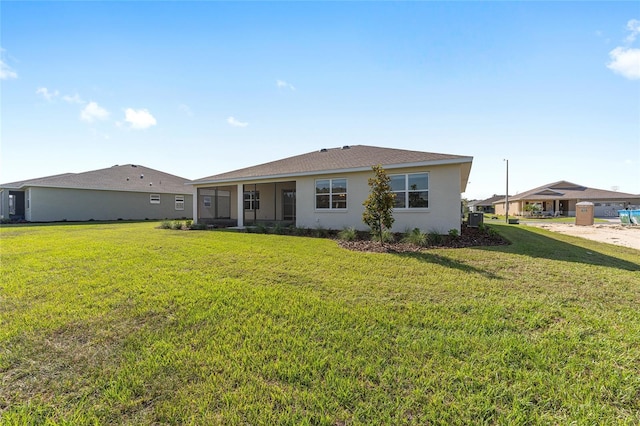 10569 SW 98th Pl, Ocala, FL 34481 - back of house with a yard and stucco siding