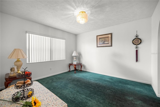 2521 NW 45th Pl, Ocala, FL 34475 - unfurnished room with carpet flooring, baseboards, and a textured ceiling