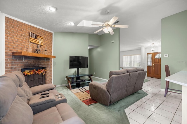 2521 NW 45th Pl, Ocala, FL 34475 - living area with a ceiling fan, a fireplace, baseboards, a skylight, and lofted ceiling