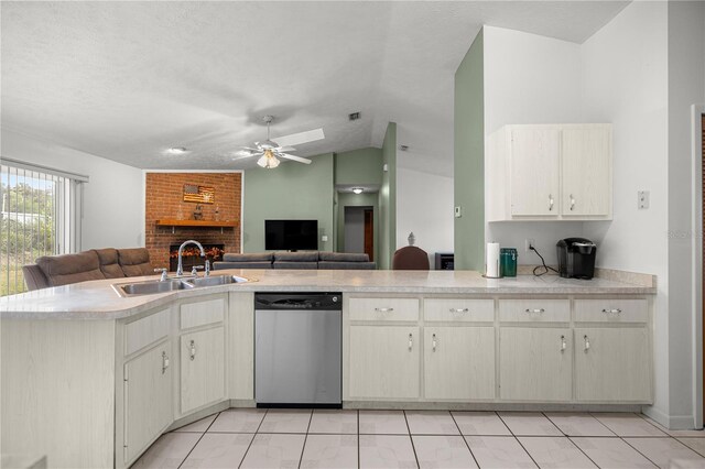 2521 NW 45th Pl, Ocala, FL 34475 - kitchen featuring stainless steel dishwasher, a sink, open floor plan, light countertops, and vaulted ceiling
