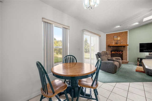 2521 NW 45th Pl, Ocala, FL 34475 - dining room with vaulted ceiling, light carpet, a brick fireplace, baseboards, and light tile patterned floors