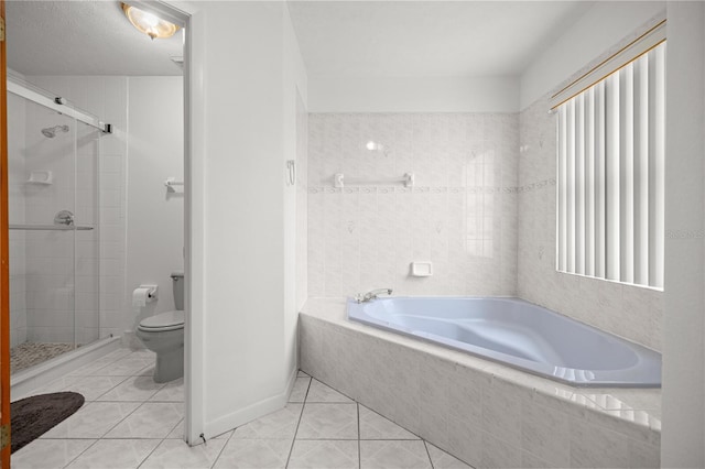 2521 NW 45th Pl, Ocala, FL 34475 - full bathroom featuring toilet, a stall shower, a bath, and tile patterned floors