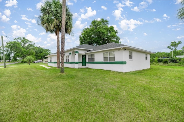 2521 NW 45th Pl, Ocala, FL 34475 - view of front of property featuring stucco siding, a front lawn, and roof with shingles