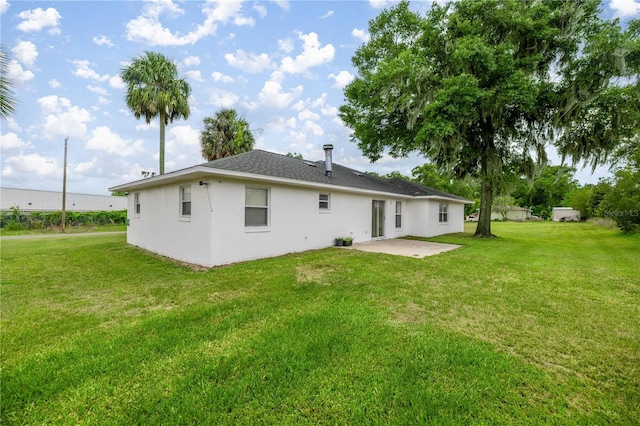 2521 NW 45th Pl, Ocala, FL 34475 - back of house featuring a patio area and a yard