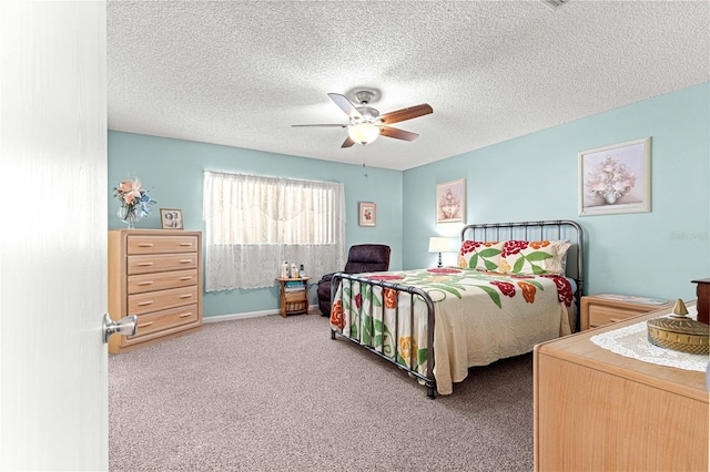 8710 SW 91st St Unit E, Ocala, FL 34481 - bedroom featuring carpet flooring, ceiling fan, and a textured ceiling