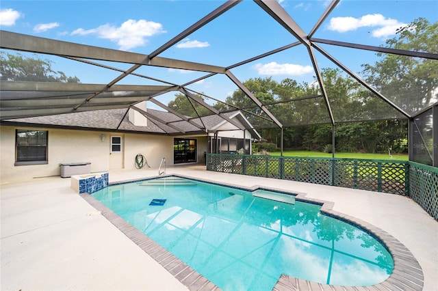 swimming pool with a patio area and a lanai