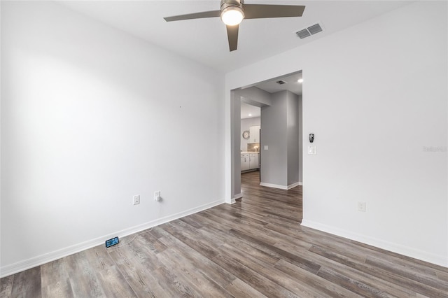 10427 SW 98th Place Rd, Ocala, FL 34481 - spare room featuring a ceiling fan, wood finished floors, and baseboards