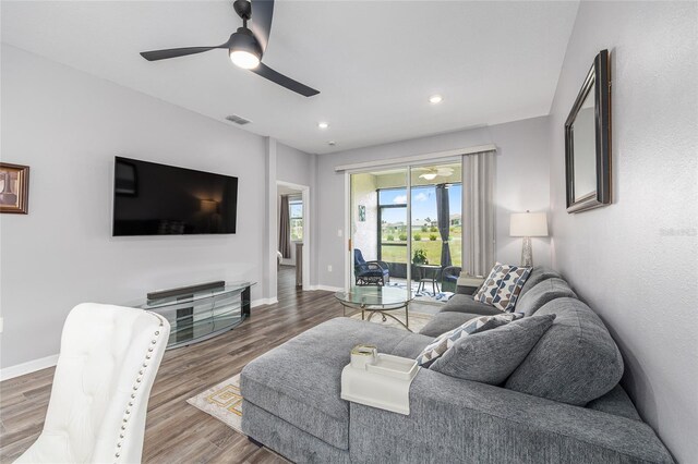 10427 SW 98th Place Rd, Ocala, FL 34481 - living room featuring wood finished floors, baseboards, ceiling fan, and recessed lighting