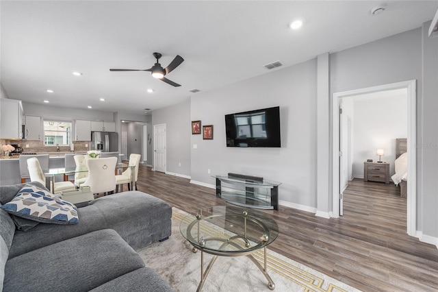 10427 SW 98th Place Rd, Ocala, FL 34481 - living area featuring wood finished floors, baseboards, recessed lighting, and a ceiling fan