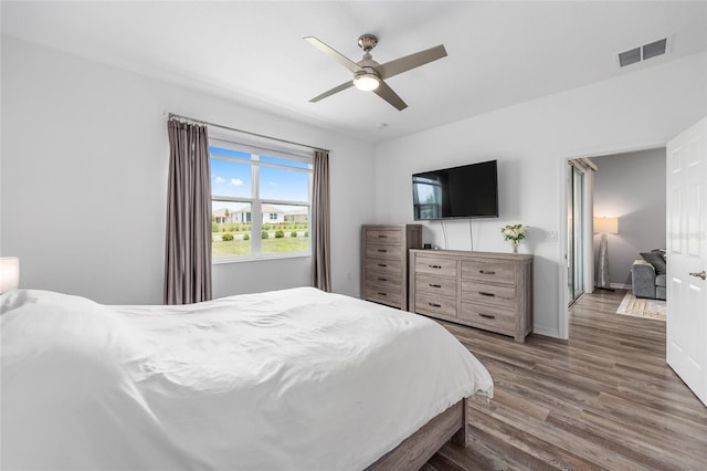 10427 SW 98th Place Rd, Ocala, FL 34481 - bedroom featuring wood finished floors, a ceiling fan, and baseboards