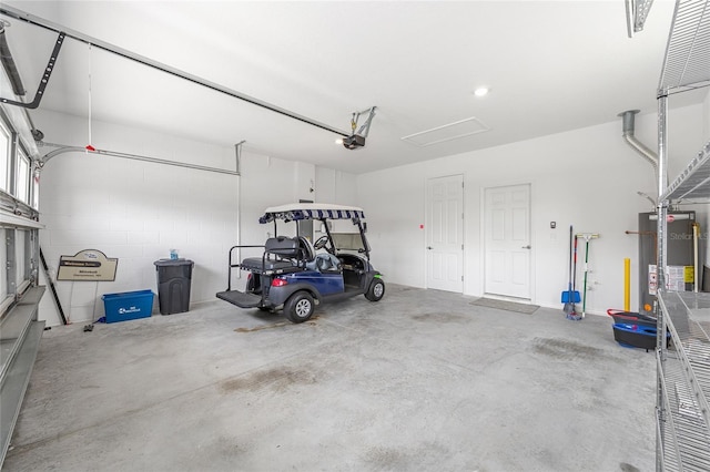 10427 SW 98th Place Rd, Ocala, FL 34481 - garage featuring water heater and a garage door opener
