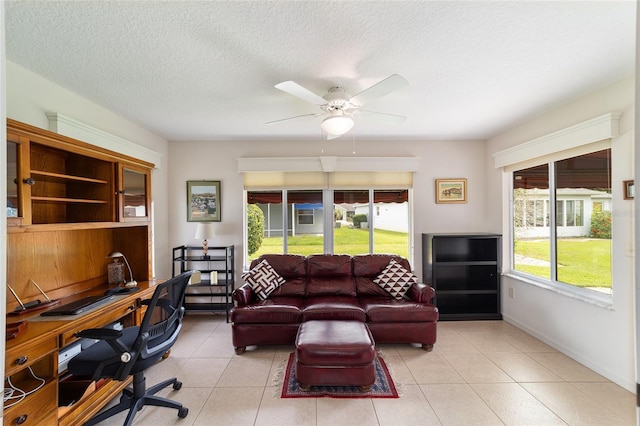 2608 Casso Ct, The Villages, FL 32162 - office area with a ceiling fan, light tile patterned floors, a textured ceiling, and baseboards