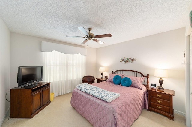 2608 Casso Ct, The Villages, FL 32162 - bedroom with light colored carpet, ceiling fan, and a textured ceiling