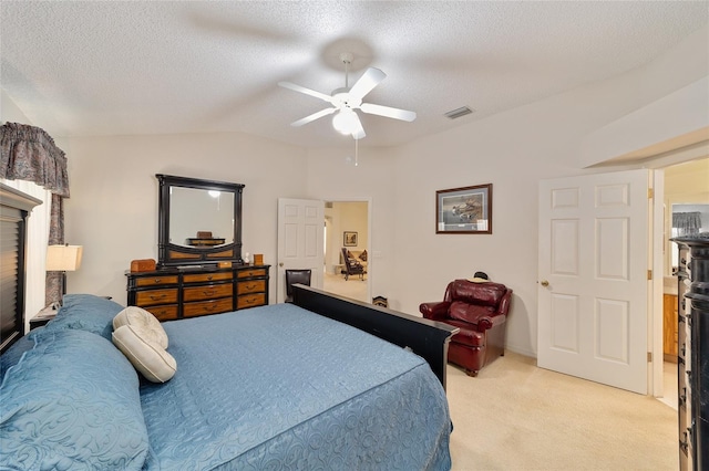 2608 Casso Ct, The Villages, FL 32162 - bedroom with light colored carpet, vaulted ceiling, a textured ceiling, and ceiling fan