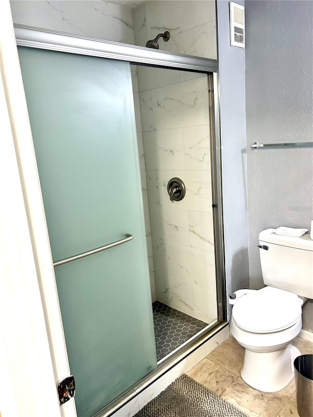 3705 SW 27th St Unit 621, Gainesville, FL 32608 - full bath featuring a stall shower, toilet, and marble finish floors