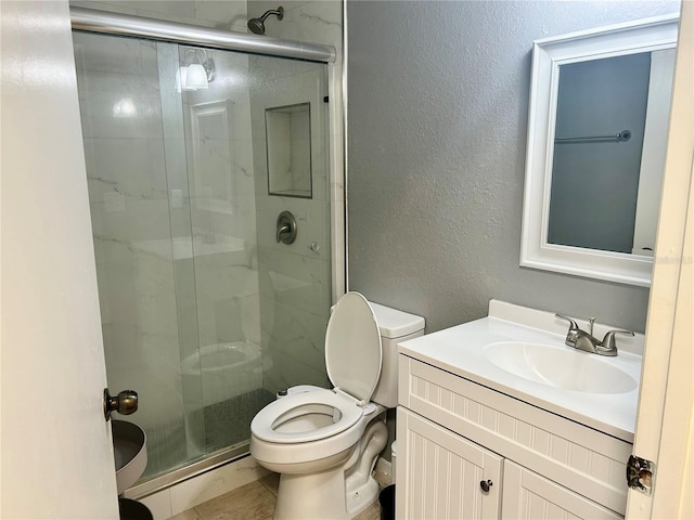 3705 SW 27th St Unit 621, Gainesville, FL 32608 - full bath with a shower stall, toilet, vanity, and a textured wall