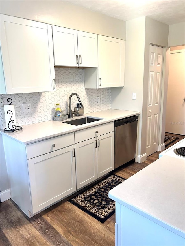 2715 NW 104th Ct Unit 1, Gainesville, FL 32606 - kitchen with a sink, stainless steel dishwasher, dark wood-type flooring, and white cabinetry