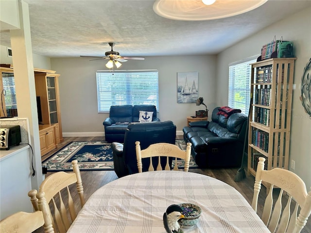 2715 NW 104th Ct Unit 1, Gainesville, FL 32606 - dining area with a ceiling fan, baseboards, wood finished floors, and a textured ceiling
