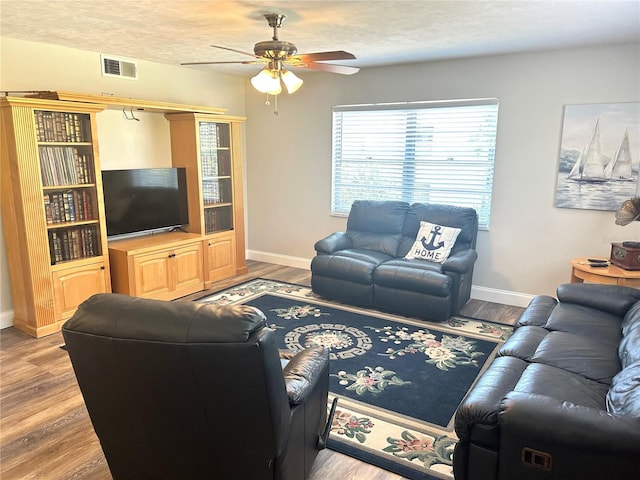 2715 NW 104th Ct Unit 1, Gainesville, FL 32606 - living room featuring ceiling fan, baseboards, and wood finished floors
