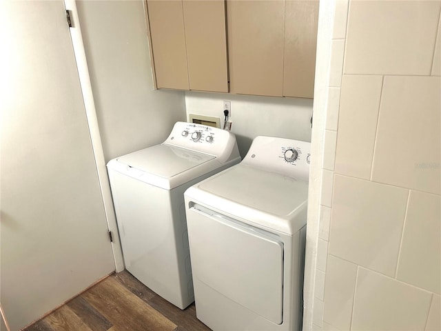 2715 NW 104th Ct Unit 1, Gainesville, FL 32606 - laundry room with wood finished floors, independent washer and dryer, and cabinet space