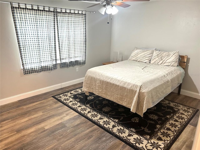 2715 NW 104th Ct Unit 1, Gainesville, FL 32606 - bedroom featuring wood finished floors, baseboards, and ceiling fan