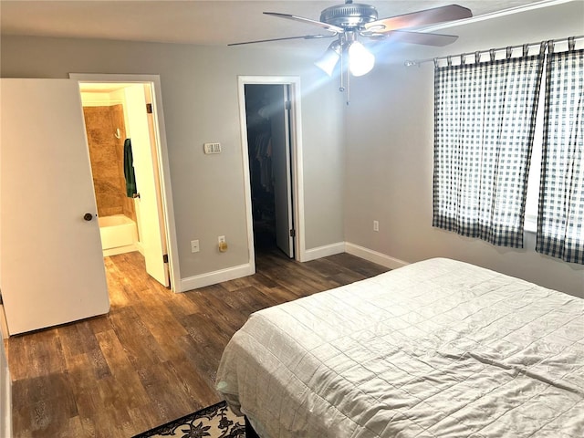 2715 NW 104th Ct Unit 1, Gainesville, FL 32606 - bedroom featuring wood finished floors, baseboards, a spacious closet, ensuite bath, and a ceiling fan