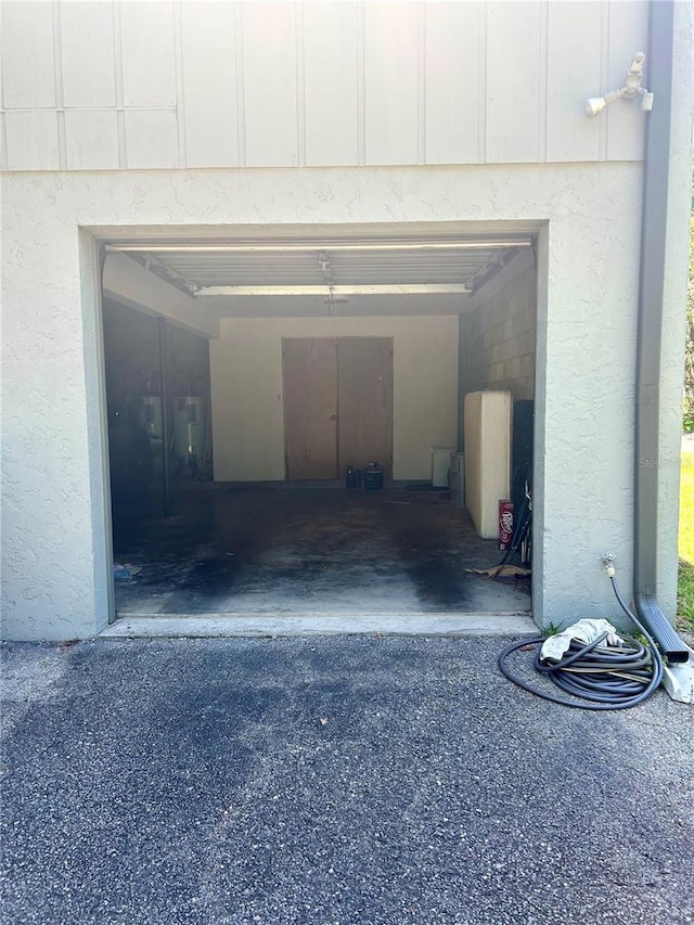 2715 NW 104th Ct Unit 1, Gainesville, FL 32606 - garage featuring asphalt driveway