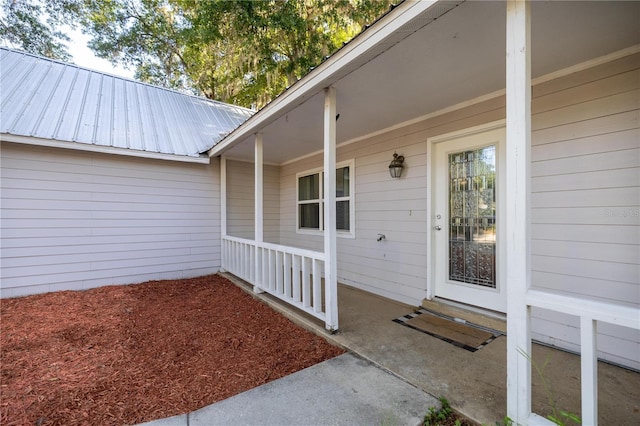 9 Juniper Pass Trl, Ocala, FL 34480 - entrance to property with a porch and metal roof