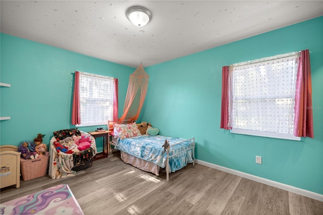 9 Juniper Pass Trl, Ocala, FL 34480 - bedroom featuring wood finished floors and baseboards