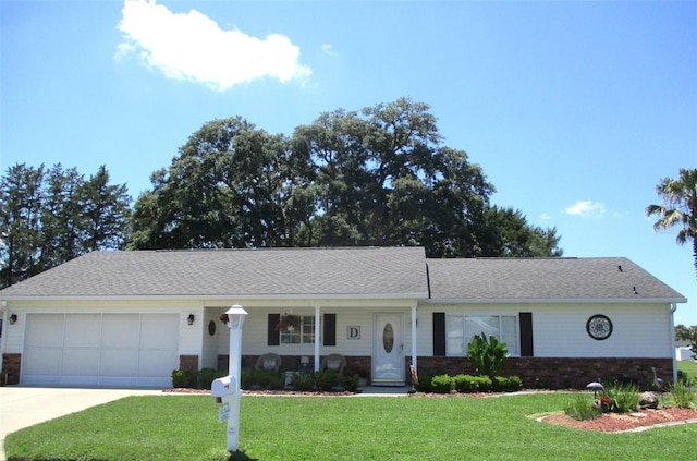 13762 SW 112th Ter, Dunnellon, FL 34432 - ranch-style house featuring a front lawn, an attached garage, driveway, brick siding, and a shingled roof