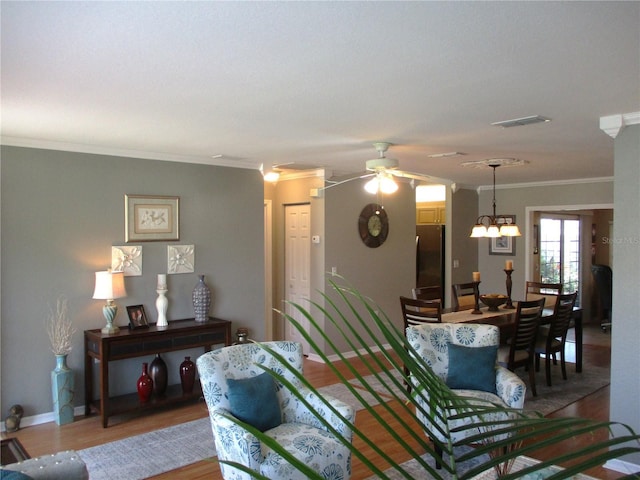 13762 SW 112th Ter, Dunnellon, FL 34432 - living room with crown molding, light wood finished floors, ceiling fan, and baseboards