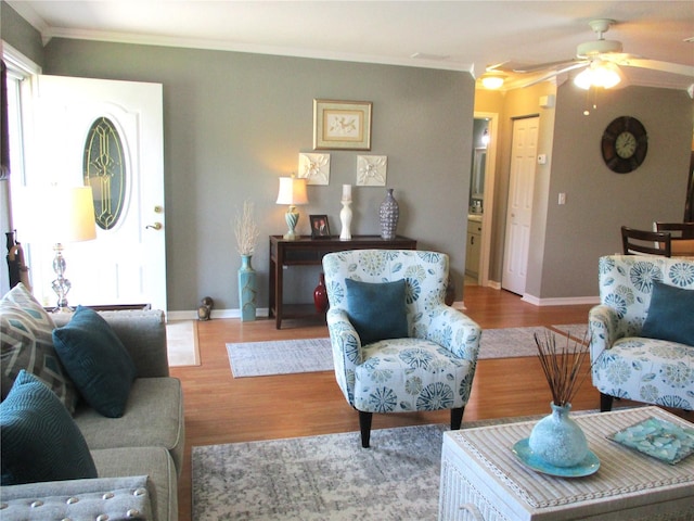 13762 SW 112th Ter, Dunnellon, FL 34432 - living area featuring crown molding, a ceiling fan, wood finished floors, and baseboards