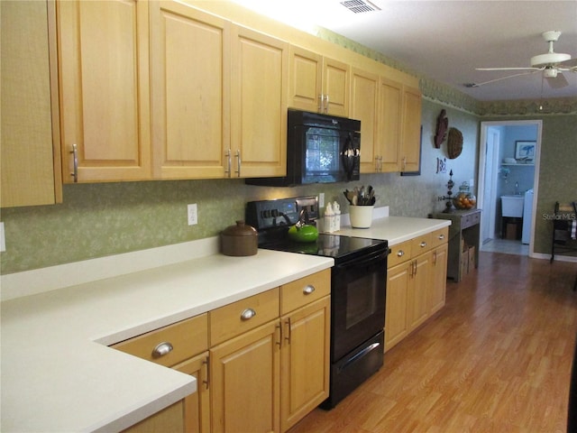 13762 SW 112th Ter, Dunnellon, FL 34432 - kitchen featuring black appliances, light wood-style flooring, a ceiling fan, light countertops, and light brown cabinetry