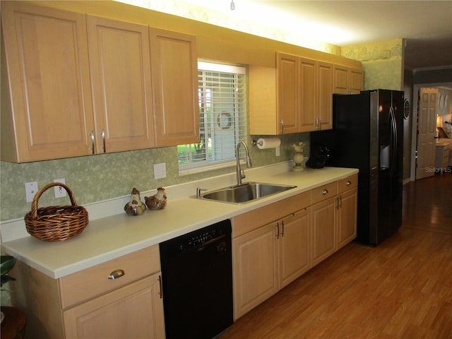 13762 SW 112th Ter, Dunnellon, FL 34432 - kitchen with black appliances, a sink, light wood finished floors, and light countertops