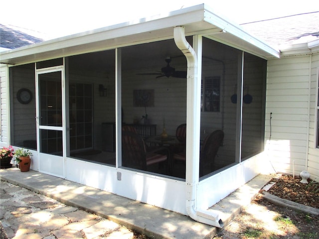 13762 SW 112th Ter, Dunnellon, FL 34432 - view of side of property featuring a sunroom and a shingled roof