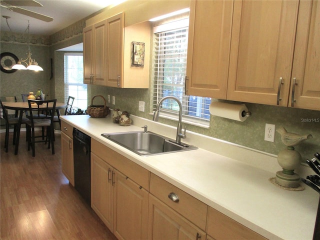 13762 SW 112th Ter, Dunnellon, FL 34432 - kitchen featuring black dishwasher, a sink, light countertops, light wood-type flooring, and a ceiling fan
