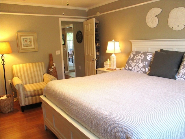 13762 SW 112th Ter, Dunnellon, FL 34432 - bedroom with wood finished floors and ornamental molding