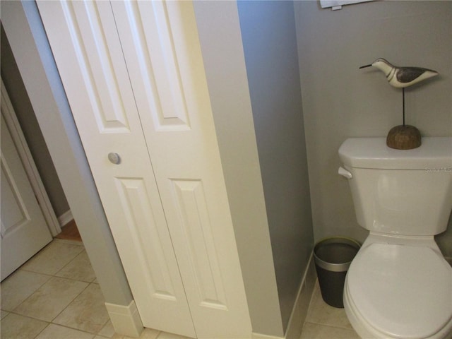 13762 SW 112th Ter, Dunnellon, FL 34432 - bathroom featuring toilet, tile patterned floors, and baseboards