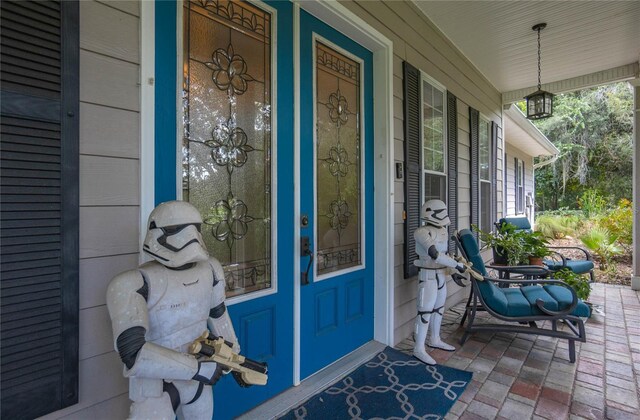 9709 E Baymeadows Dr, Inverness, FL 34450 - entrance to property featuring covered porch