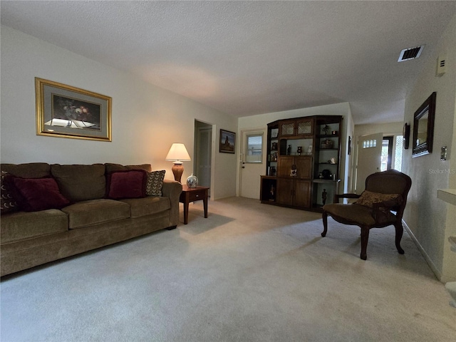 living area featuring light colored carpet