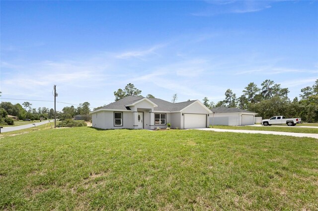 3079 SW 168th Loop, Ocala, FL 34473 - ranch-style home with concrete driveway, a front lawn, and a garage