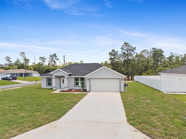 3079 SW 168th Loop, Ocala, FL 34473 - view of front of property with a garage, concrete driveway, a front lawn, and stucco siding