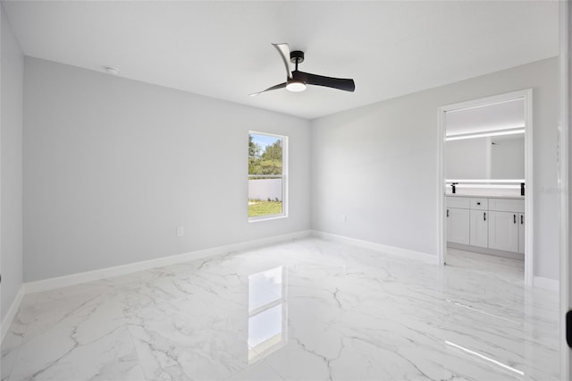3079 SW 168th Loop, Ocala, FL 34473 - unfurnished bedroom with light marble finish flooring, ensuite bathroom, and ceiling fan