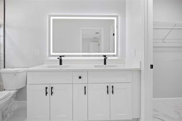 3079 SW 168th Loop, Ocala, FL 34473 - bathroom with marble finish flooring, double vanity, and a walk in closet