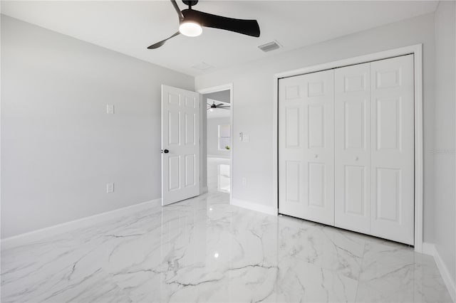 3079 SW 168th Loop, Ocala, FL 34473 - unfurnished bedroom with marble finish floors, a closet, and ceiling fan