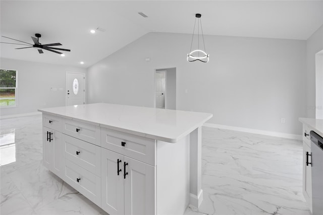 3079 SW 168th Loop, Ocala, FL 34473 - kitchen featuring light marble finish floors, ceiling fan, white cabinetry, pendant lighting, and vaulted ceiling