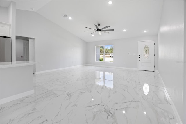 3079 SW 168th Loop, Ocala, FL 34473 - unfurnished living room featuring lofted ceiling, a ceiling fan, light marble finish flooring, and recessed lighting