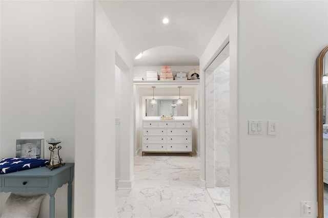 11416 NW State Road 45, High Springs, FL 32643 - corridor with light marble finish floors and arched walkways