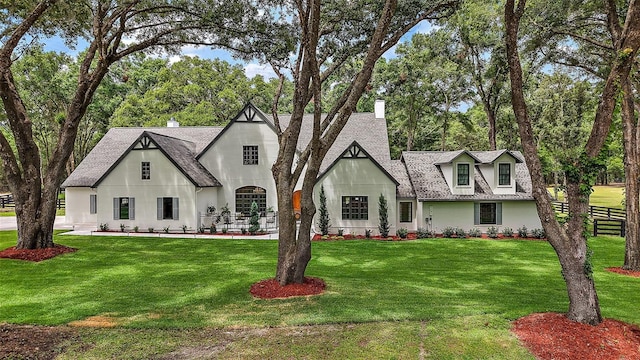 11416 NW State Road 45, High Springs, FL 32643 - view of front of home with a shingled roof, a chimney, and stucco siding