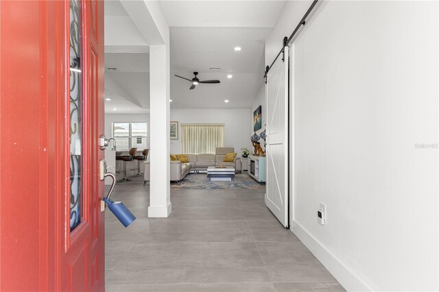 10291 SE 67th Ter, Belleview, FL 34420 - corridor featuring a barn door, recessed lighting, and baseboards